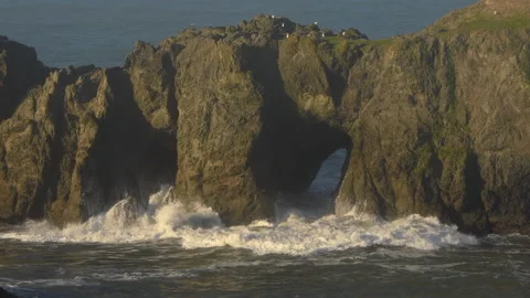 Ocean waves explode through rocky arches, Bandon, Oregon Coast Video stock 170204977