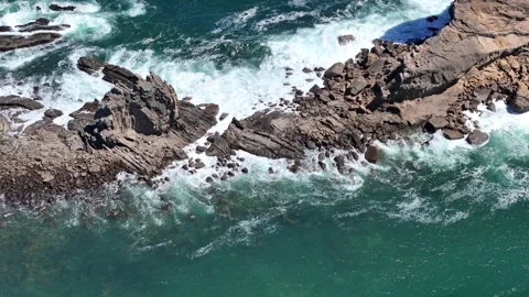 Ocean waves fall on rocky cliff background  Stock Footage 332318036