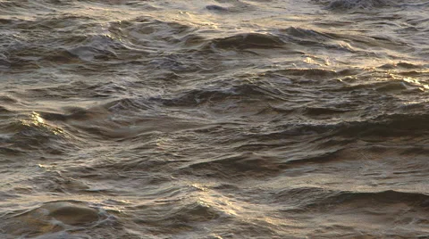 OCEAN WAVES FILLING FRAME; SUNSET OR SUNRISE LIGHT; NEGATIVE SPACE Stock Footage 59071005