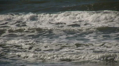 Ocean waves flow towards shore on sunny day (High Definition) Stock Footage 365022