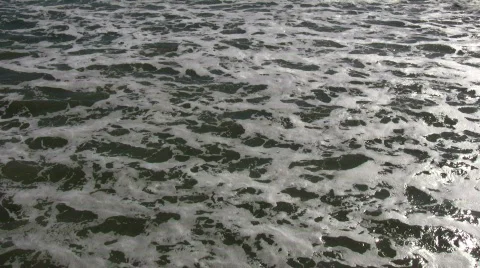 Ocean waves flow towards shore on sunny day (High Definition) Stock Footage 365051