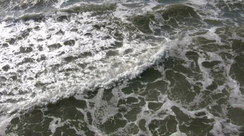 Ocean waves flow towards shore on sunny day (High Definition) Stock Footage 365052