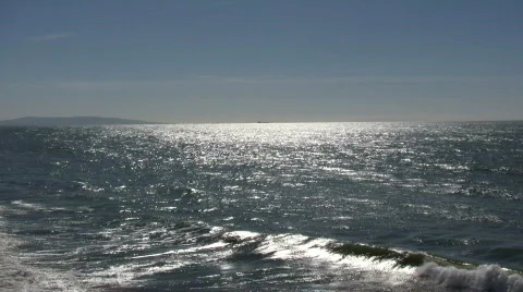 Ocean waves flow towards shore on sunny day (High Definition) Stock Footage 365054