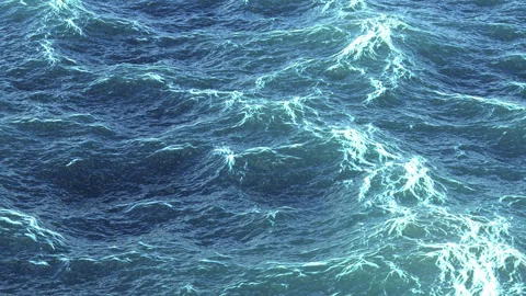 Ocean waves with foam patterns moving across the water's surface Stock Footage 283517066