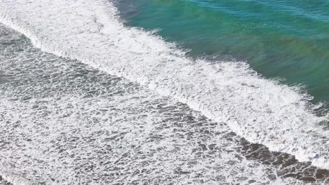Ocean waves with foam reaching beach shore, scenic tropical seascape background Stock Footage 310529320