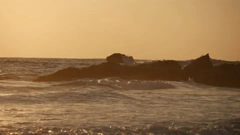 Ocean waves gently hitting the coastal rocks Stock Footage 234729314