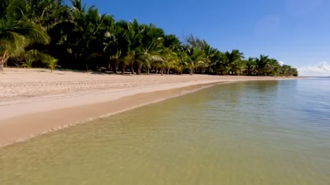 Ocean waves gently lapping against beach Video stock 242026339