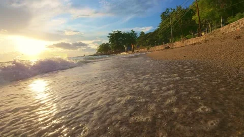 Ocean Waves Gently Lapping on Sandy Shore. Slow motion Stock Footage 303668550