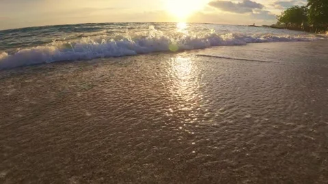 Ocean Waves Gently Lapping on Sandy Shore. Slow motion Stock Footage 303669155