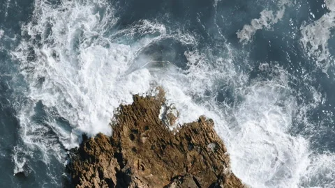 Ocean waves hit the rock rotating topshot aerial view in portugal Stock Footage 146226271