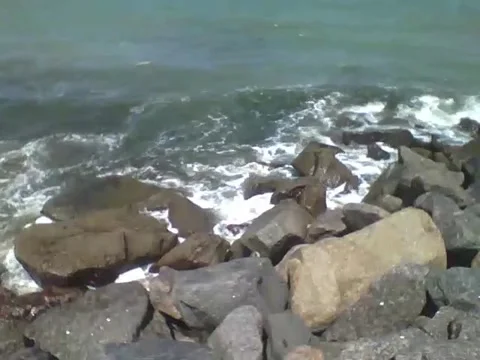 The ocean waves hit the rocks hard on the beach, very relaxing! Stock Footage 163684232