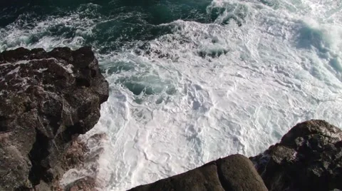 Ocean waves hit volcanic rocks at the shore of the Gris Gris in Mauritius. Stock Footage 48572955