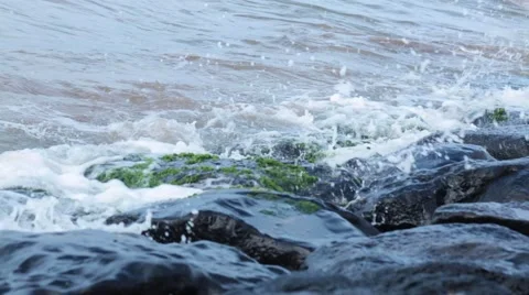 Ocean waves hitting black rocks Stock Footage 57463807