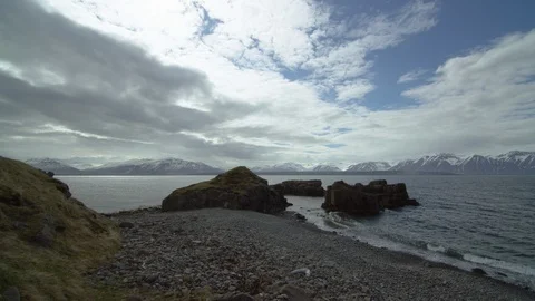 Ocean waves hitting coast with cloudy sky background, Iceland Stock Footage 124229856