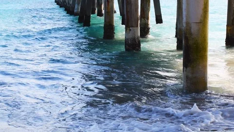 Ocean waves hitting a pier Stock Footage 108642108