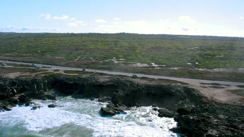 Ocean Waves hitting rocks. Road along coast. Portuguese nature beauty Stock Footage 164971770
