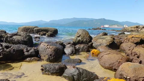 Ocean waves hitting the rocks. Video of beautiful landscape of stones Stock Footage 171274217