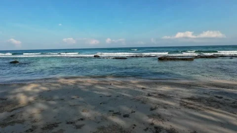 Ocean waves hitting a rocky coral beach Stock Footage 321260120