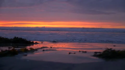 Ocean Waves Hitting Shore with Sunset Stock Footage 170339941
