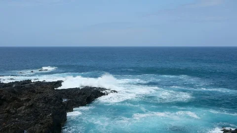 Ocean waves hitting shore - waves crashing on black rock coeast Stock Footage 96229535