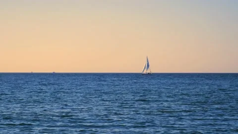 Ocean waves with horizon and blue sky. Baltic sea with sailing boat. Stock Footage 155329666