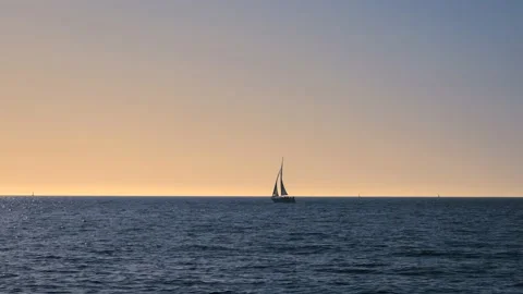 Ocean waves with horizon and blue sky. Baltic sea with sailing boat. Stock Footage 155331820