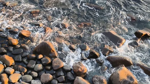 Ocean waves illustrate continuous coastal erosion. Evidence of environmental Stock Footage 324136903