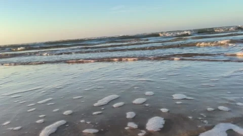 Ocean Waves Lapping on Sandy Beach at Sunset - Close Up Stock Footage 340215867