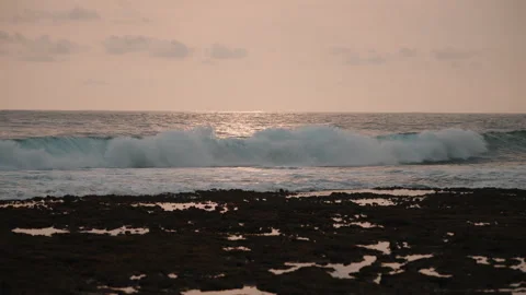 Ocean Waves at Low Tide with Sunset Reflection Stock Footage 303392803