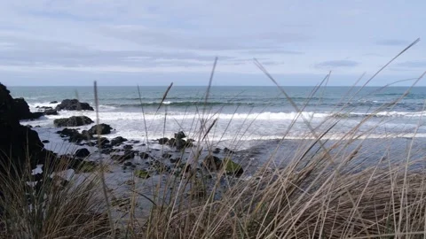 Ocean waves meet River Bush at Portballintrae Vídeos de archivo 304992560