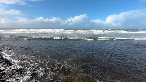Ocean waves moving in sunny summer coast Stock Footage 121453230