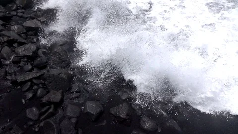 Ocean waves over black rock Slow motion 1 Stock Footage 103988108
