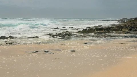 Ocean waves over sand beach in Fuertevenura Video stock 76882861