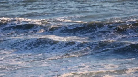 Ocean waves pan left to gannet colony Stock Footage 74659517