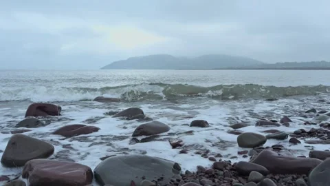 Ocean waves on a pebble beach, Britian, UK Video stock 291705482