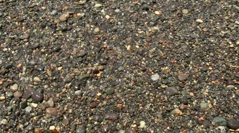 Ocean waves on pebbles V3 - HD Stock Footage 779345