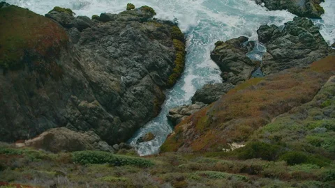 Ocean waves pour into a small rocky enclave along the coast, Big Sur, California Stock Footage 93755584