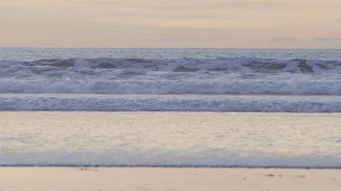 Ocean waves RED 4k sunset close up.R3D slowmo tilt Stock Footage 103545106