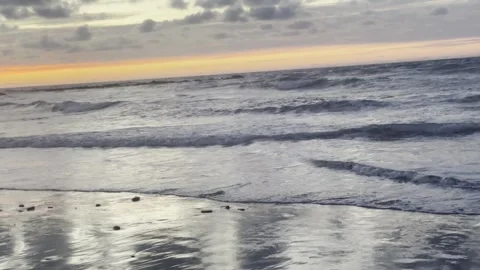 Ocean Waves Reflecting Sunset Light On Beach For Nature Background Video Length Stock Footage 334871940