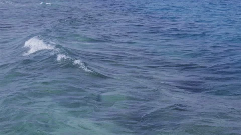 Ocean waves rippling under sunlight. Slow motion. Stock Footage 323122762