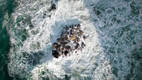 The ocean waves on the rock Stock Photos