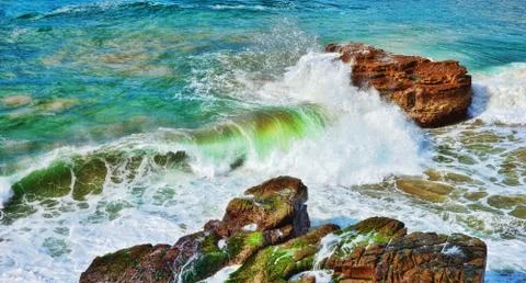 Ocean waves on rocks Stock Photos
