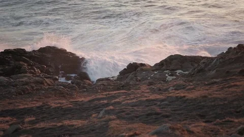 Ocean waves on the rocks. Yellow sun over sea.  Stock Footage 151179499