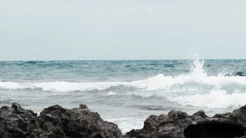 Ocean waves on a rocky beach Stock Footage 138697854