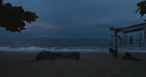 The ocean waves roll break on sand beach in the dark night. Stock Footage 203195384