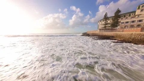 Ocean waves roll near seaside cliffs Stock Footage 344550530