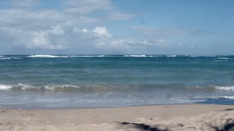 Ocean waves rolling onto a beach Stock Footage 124217371