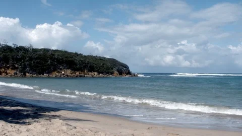Ocean waves rolling onto a beach Stock Footage 124217791