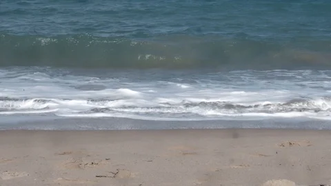 Ocean waves rolling onto a beach Stock Footage 124218115