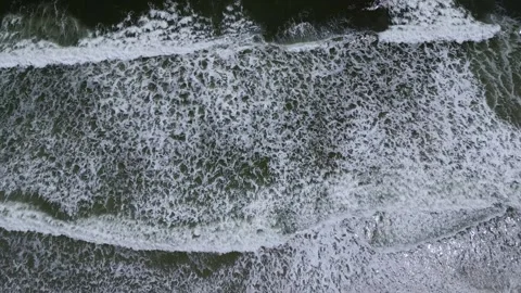 Ocean waves rolling in - drone video Stock Footage 240666613